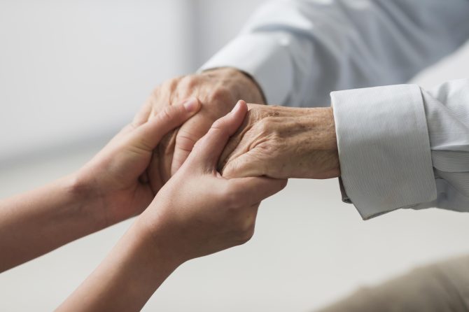 man holding hands with woman